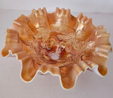 Antique Dugan 3 footed carnival glass bowl in a peach opalescent color