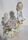 Lladro "style" Porcelaine Figure of 2 girls with Flowers in a wheelbarrow