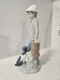 Nao by Lladro figurine Affectionate Pup Boy with dog -Model #0201038