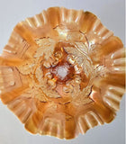 Antique Dugan 3 footed carnival glass bowl in a peach opalescent color
