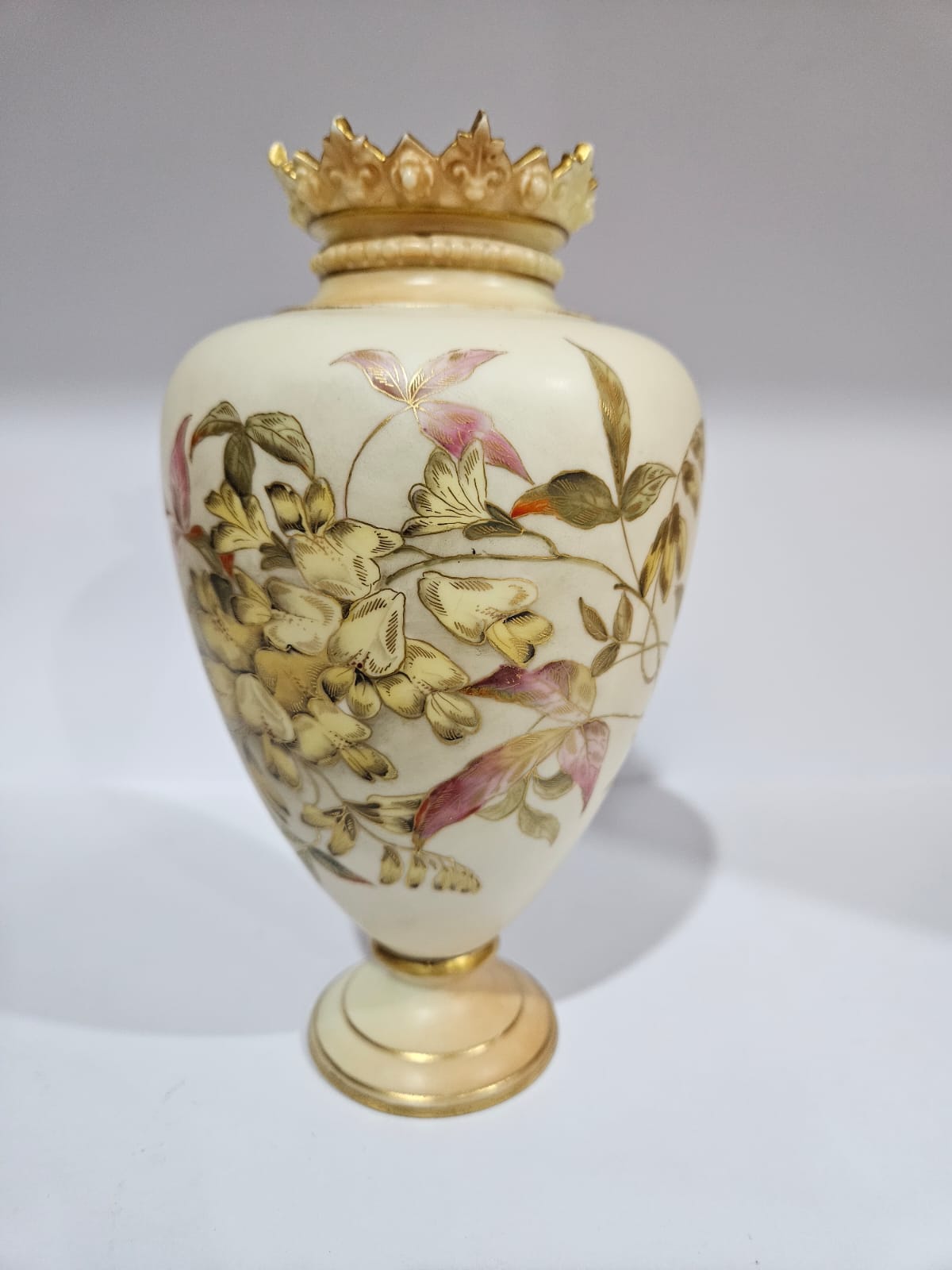 A Royal Worcester blush ivory vase with gilt and floral decoration dated 1879
