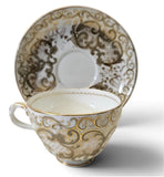 Antique "Vieux Paris" porcelain teacup and saucer w/ raised gold-gilt rococo scroll Circa 1850s