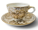 Antique "Vieux Paris" porcelain teacup and saucer w/ raised gold-gilt rococo scroll Circa 1850s